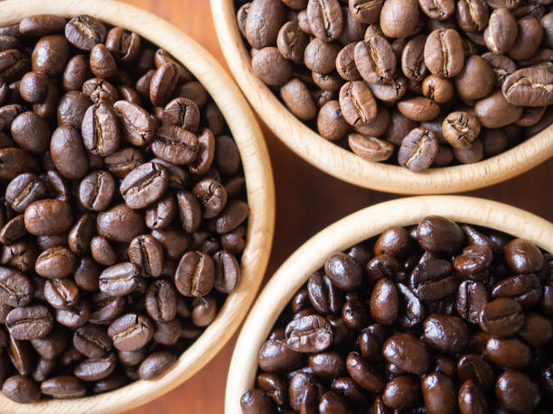 istock brown arabica coffee bean roast 3 level medium to dark different taste seed caffeine espresso drink food cafe beverage Chiang Rai, Thailand coffee on wooden table background top view selected focus 1499756832