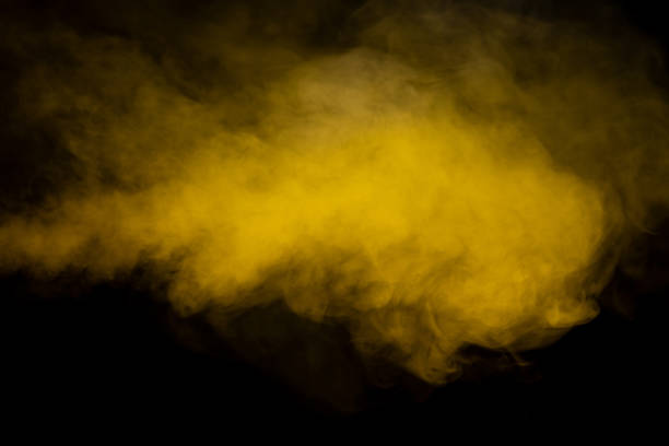istock Yellow steam on a black background. 1499756882