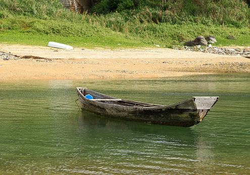 Sabani, a wooden boat in Okinawa, a scenic image of the island's past
