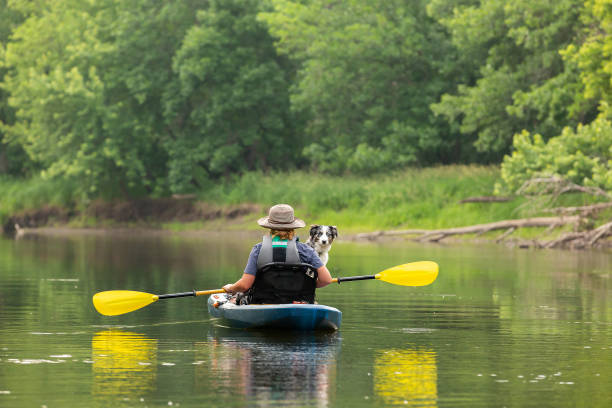 istock Girl & Dog Kayaking Down Rum River in Summer 1499758316