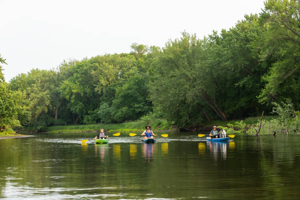 istock Family With Dog Kayaking Down Rum River in Summer 1499758378