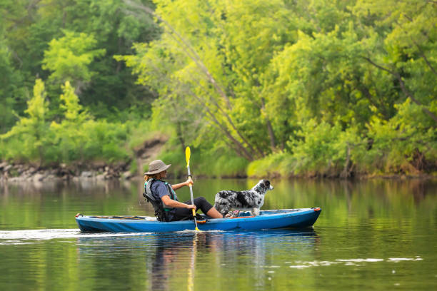 istock Girl & Dog Kayaking Down Rum River in Summer 1499758423