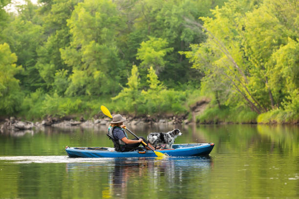 istock Girl & Dog Kayaking Down Rum River in Summer 1499758436