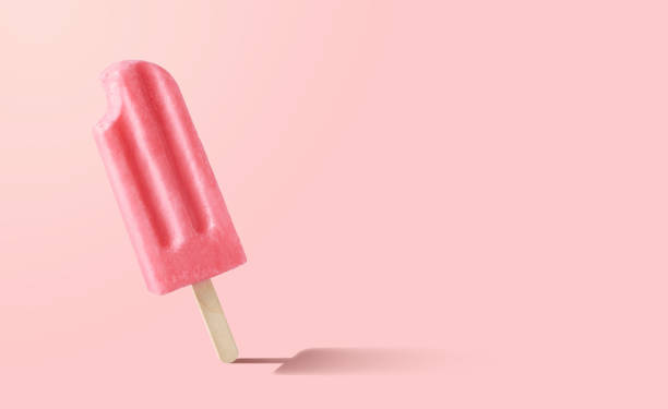 istock Bitten fruit and berry popsicle on pink background 1499759884