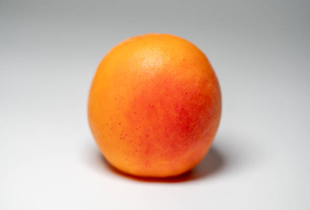 Fresh and ripe apricot isolated on a white background