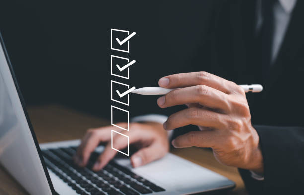istock Businessman tick correct mark to approve document iso checklist icon.checkmark quality management quality assurance or QA and quality control or QC and improvement, Standardization and certification. 1499762053