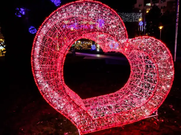 Red heart made of lights in Baia Mare. Christmas decorations