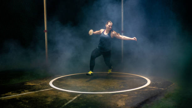 istock Athlete woman throwing discus 1499763838
