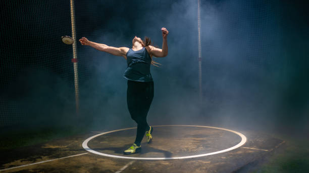 istock Athlete woman throwing discus 1499763842
