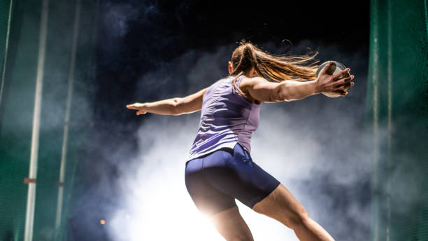 Athlete woman throwing discus