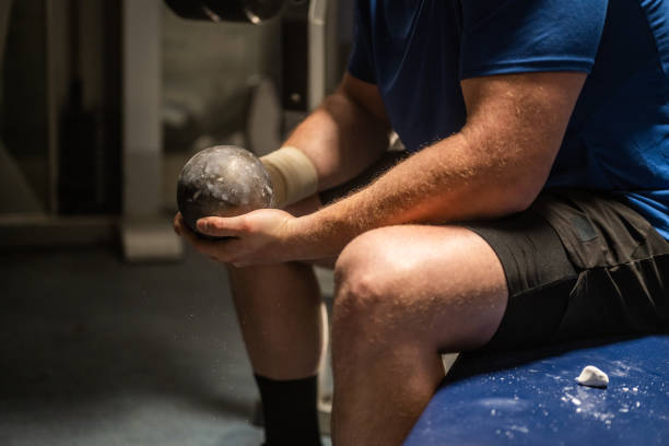 istock Athlete holding shot put ball 1499763847