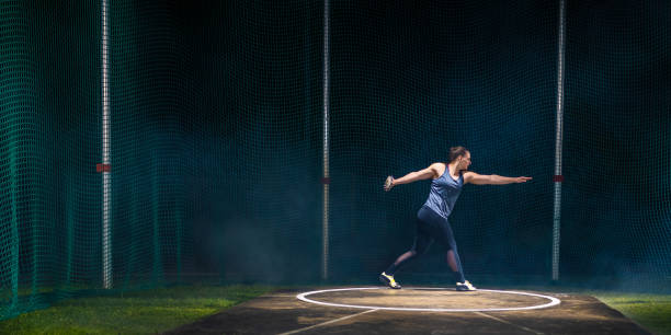 istock Athlete woman throwing discus 1499763853