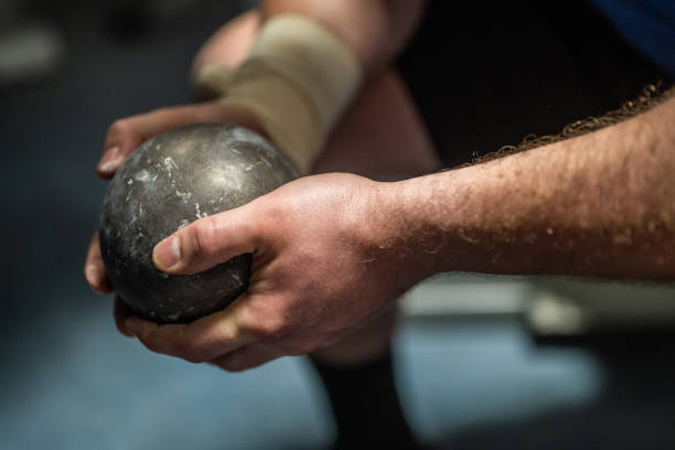 Athlete holding shot put ball