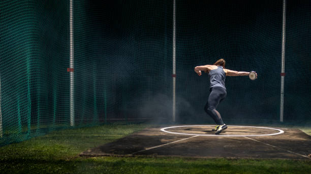 istock Athlete woman throwing discus 1499763863