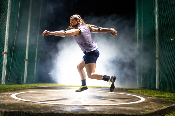 istock Athlete woman throwing discus 1499763887