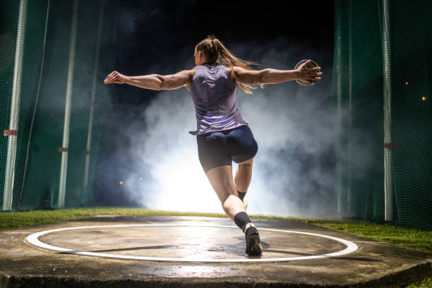 istock Athlete woman throwing discus 1499763889