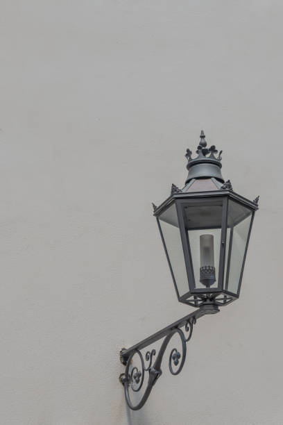 istock Old street light lamp at building wall with copy space, details, closeup. 1499766545
