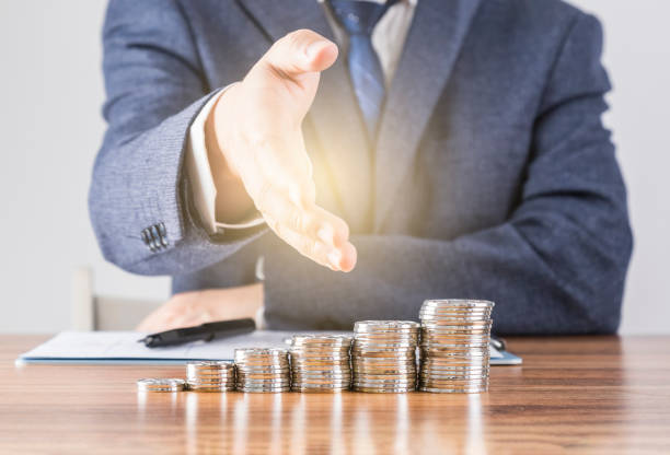 istock Businessmen and silver coins 1499768583
