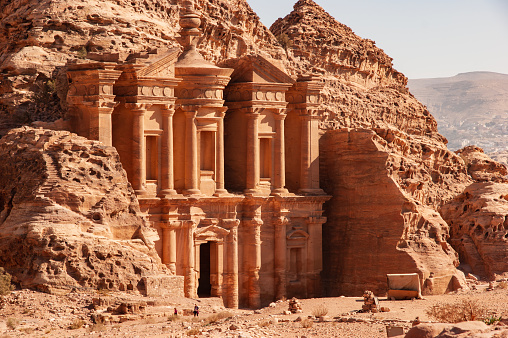 Facade of Ad-Deir Monastery in Petra Jordan. Monastery carved into sandy rocks is one of most famous sights of Petra.  Facade of Ad-Deira resembles Treasury