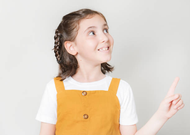 istock Thoughtful little girl looking away thinking 1499770385