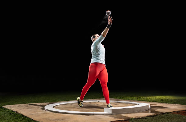 istock Female Athlete Throwing Shot Put Ball 1499770406
