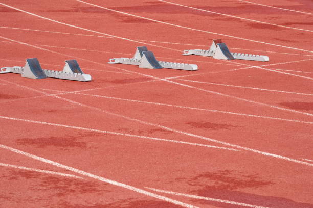 istock Tartan running track for athletic events with starting blocks 1499771088