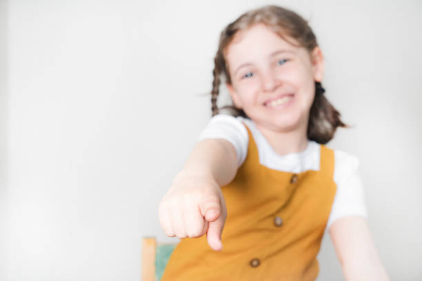 Little girl pointing at you