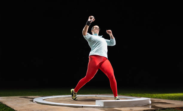 istock Female Athlete Throwing Shot Put Ball 1499775472