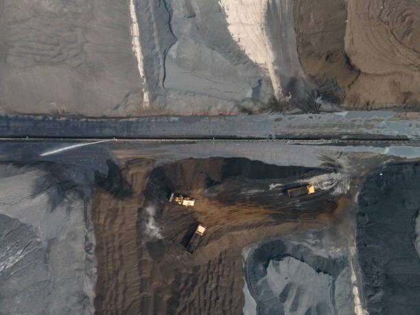 istock Aerial view of large coal yard truck loading and unloading 1499775661