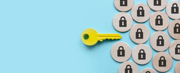 istock Security and protection concept. A yellow key among a padlock symbol. 1499780274