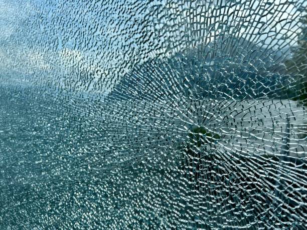 Broken safety glass with mountain in background