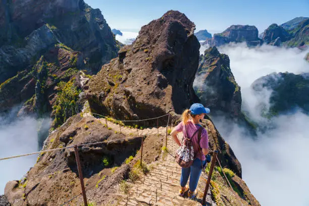 Hiker on PR1 Pico do Arieiro - Pico Ruivo trail Stairway to Heaven Madeira Portugal