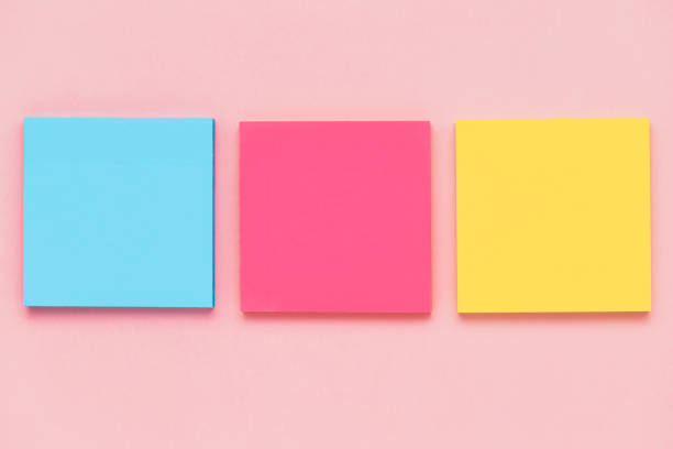 istock Sticky paper notes on pink background for office and school stationary concept 1499787151