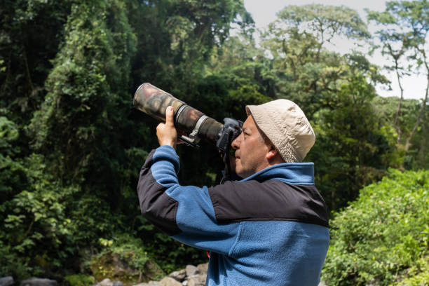 istock Nature photographer in the jungle 1499787267