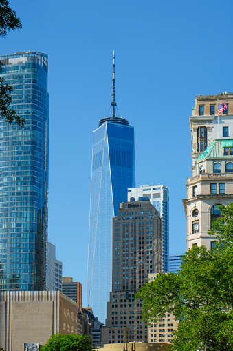 New York City, United States - May 17, 2023: A view of 50 West building, left, and One World Trade Center, in the center, in the Financial District of New York City, United States