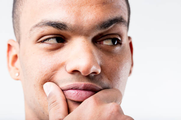 istock Close-up of thinking man, wealth or deceit 1499792384