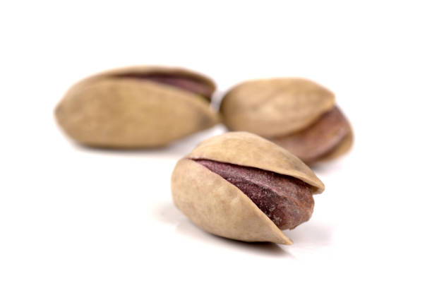 istock pistachio nuts on the white background 1499793250