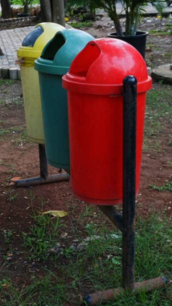 istock trash cans in the city park 1499795086
