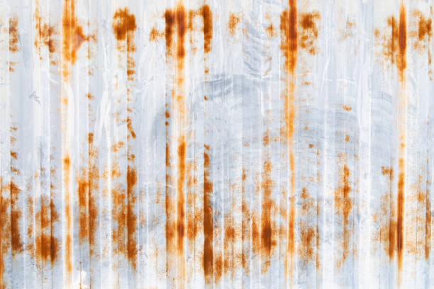 istock Old rusty zinc sheet wall. Galvanized metal corrosion. Texture and background in retro concept. 1499799717