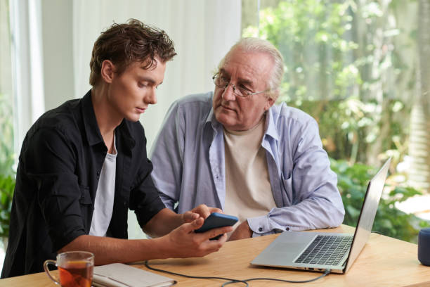 istock Senior Man Listening to Grandson 1499800076