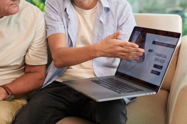 istock Man Showing Financial Services Website 1499800110