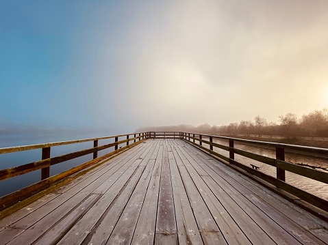 Mist at the end of a wooden pier