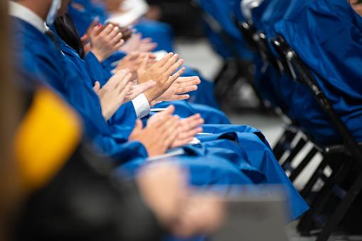 Clapping Hands closeup during high school Graduation Ceremony