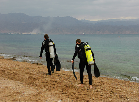 Scuba divers swimming and training