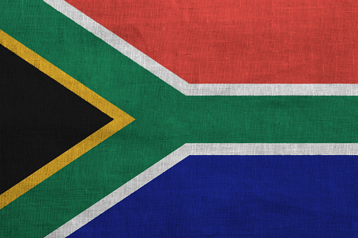 Flag of Republic of South Africa on a textured background. Concept collage.