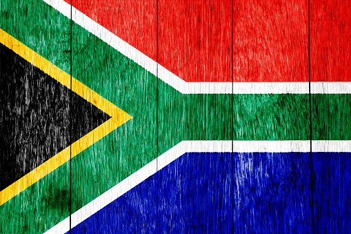 Flag of Republic of South Africa on a textured background. Concept collage.