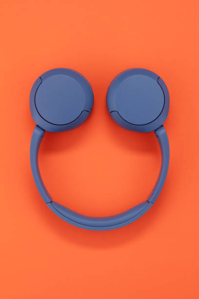 istock Blue headphones on orange color background. 1499812493