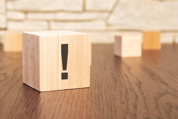 istock wooden blocks with exclamation mark on wooden table, close up. space for text 1499812944