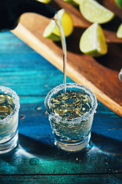 tequila shots with salt and lime - tequila shot imagens e fotografias de stock