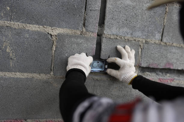 istock construction worker working by measuring the gap to place the internal piping system on the wall. new building for internal pipe system at construction site . 1499816825